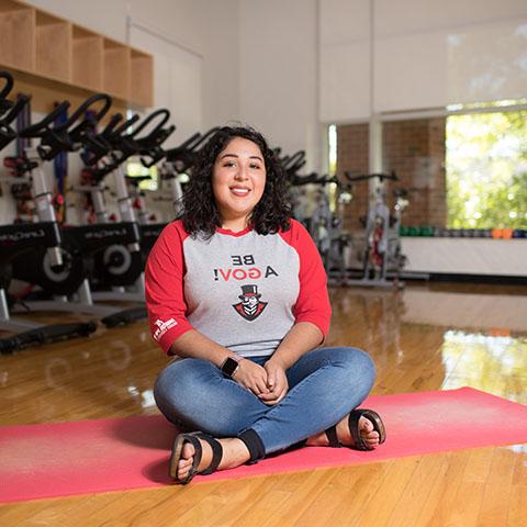 Jenny Hernandez sits in Foy Recreation Center workout rooms